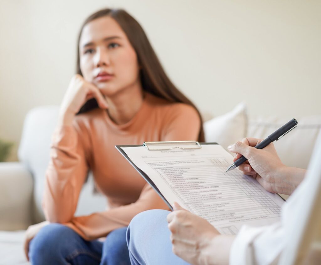 Psychologist taking notes during an assessment session